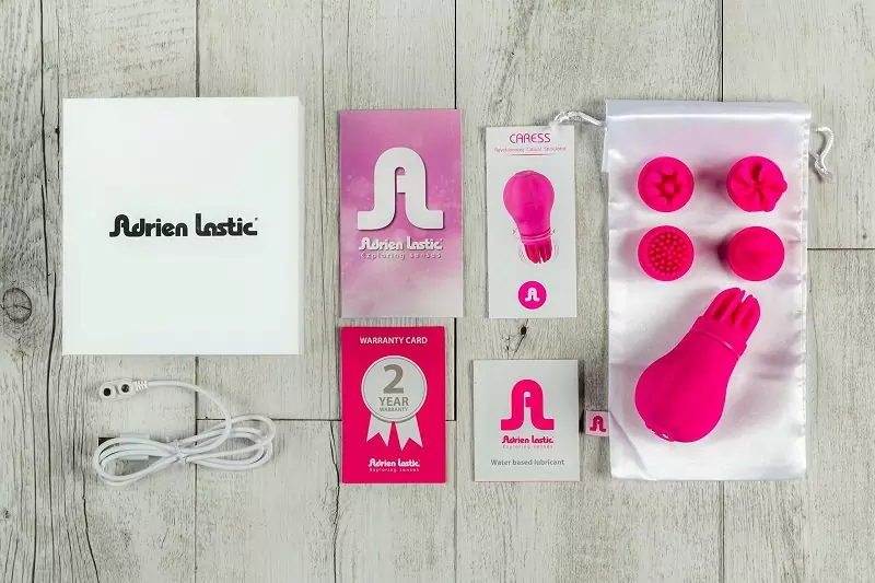 Стимулятор клитора и интимных зон Caress с 5-ю насадками - розовый